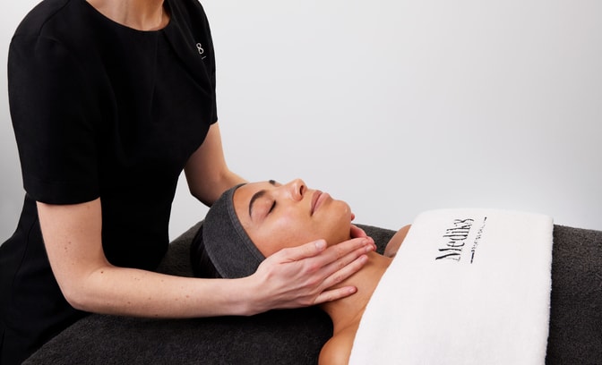 women getting a neck massage in medik8 branded towels