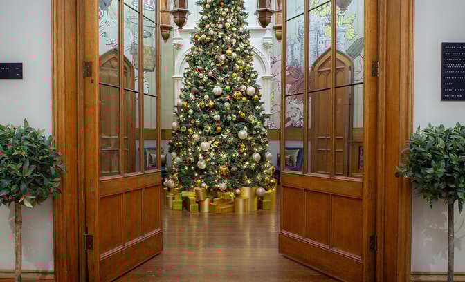 View of a Christmas tree through double doors at Studley Castle