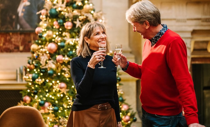 Couple enjoying festive welcome drinks
