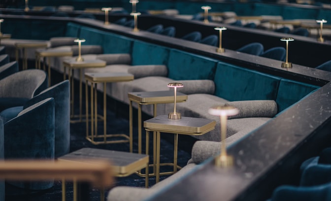 Seats and tables in the entertainment theatre venue, the Live Lounge, at the Runnymede on Thames