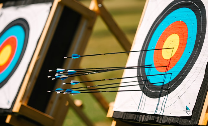Archery board with arrows in