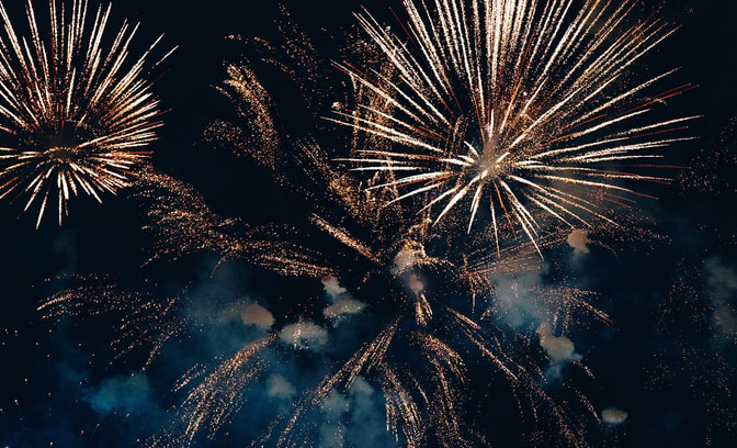 Colourful fireworks against a very dark sky