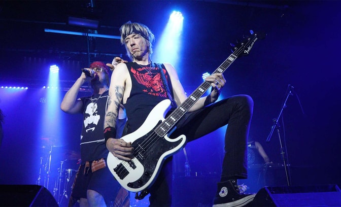 guns 2 roses performing on stage