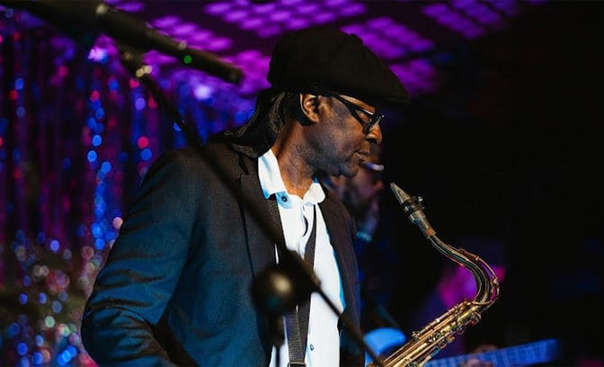 Ultimate 40 Reggae Band playing sax