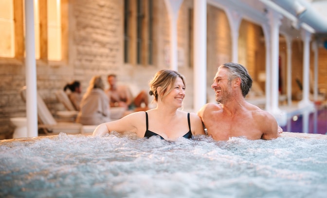 Guests relaxing in a bubble pool.