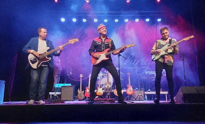Money For Nothing, tribute to the Dire Straits, performing on stage