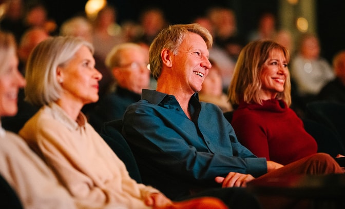 Guests enjoying an evening show
