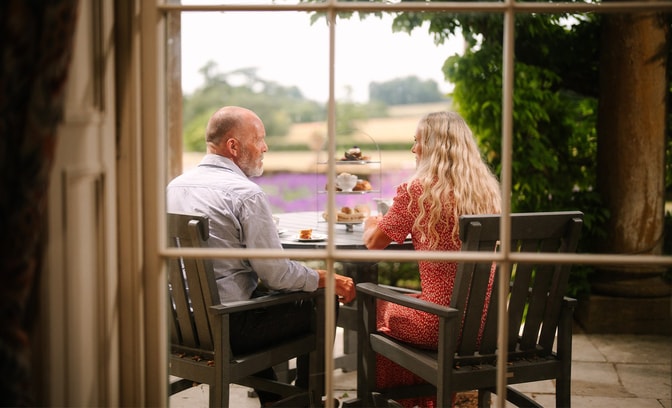Couple enjoying afternoon tea at Cricket St. Thomas