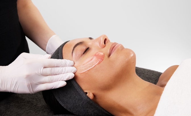 Women getting face massaged using medik8 products