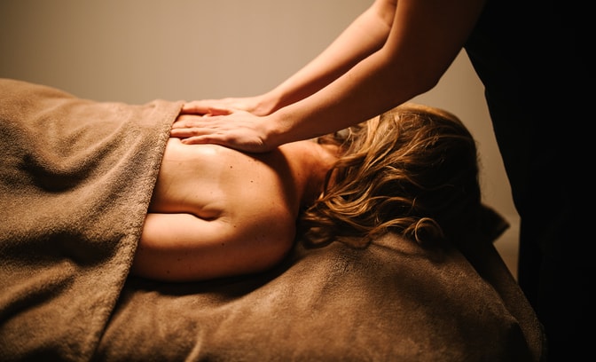 getting a back massage with towels
