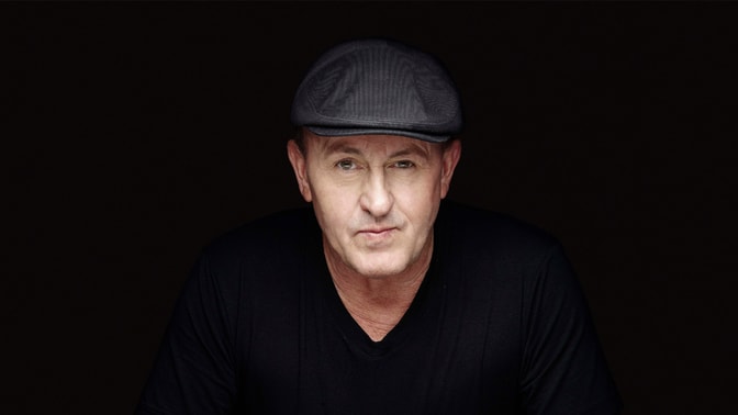danny rampling in front of black background
