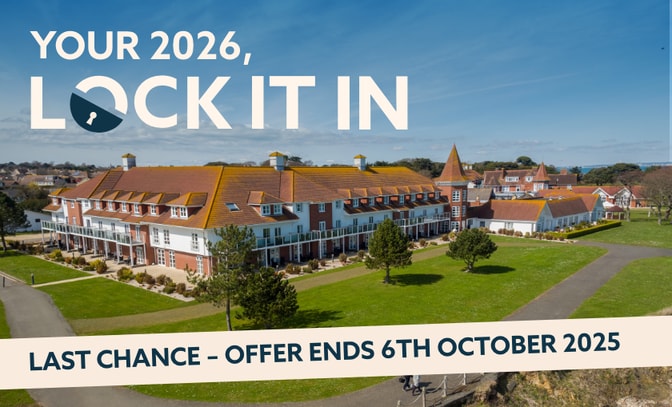 Aerial view of Bembridge Coast hotel with green landscaping, promoting a 2026 offer that ends October 6, 2025.