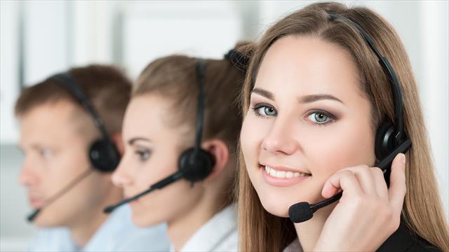 Meet the friendly face of the Warner Hotels contact centre! This image shows a woman wearing a headset, radiating happiness as she assists customers.