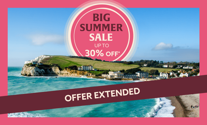 A vibrant coastal scene of the Isle of Wight highlights a summer sale with up to 30% off, featuring "offer extended" text across the bottom.