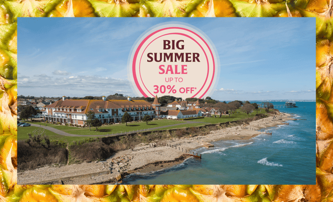 Aerial view of Bembridge Coast promoting a "Big Summer Sale" with discounts up to 30%