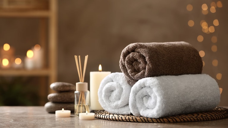 Towels and candles create a relaxed atmosphere at the spa