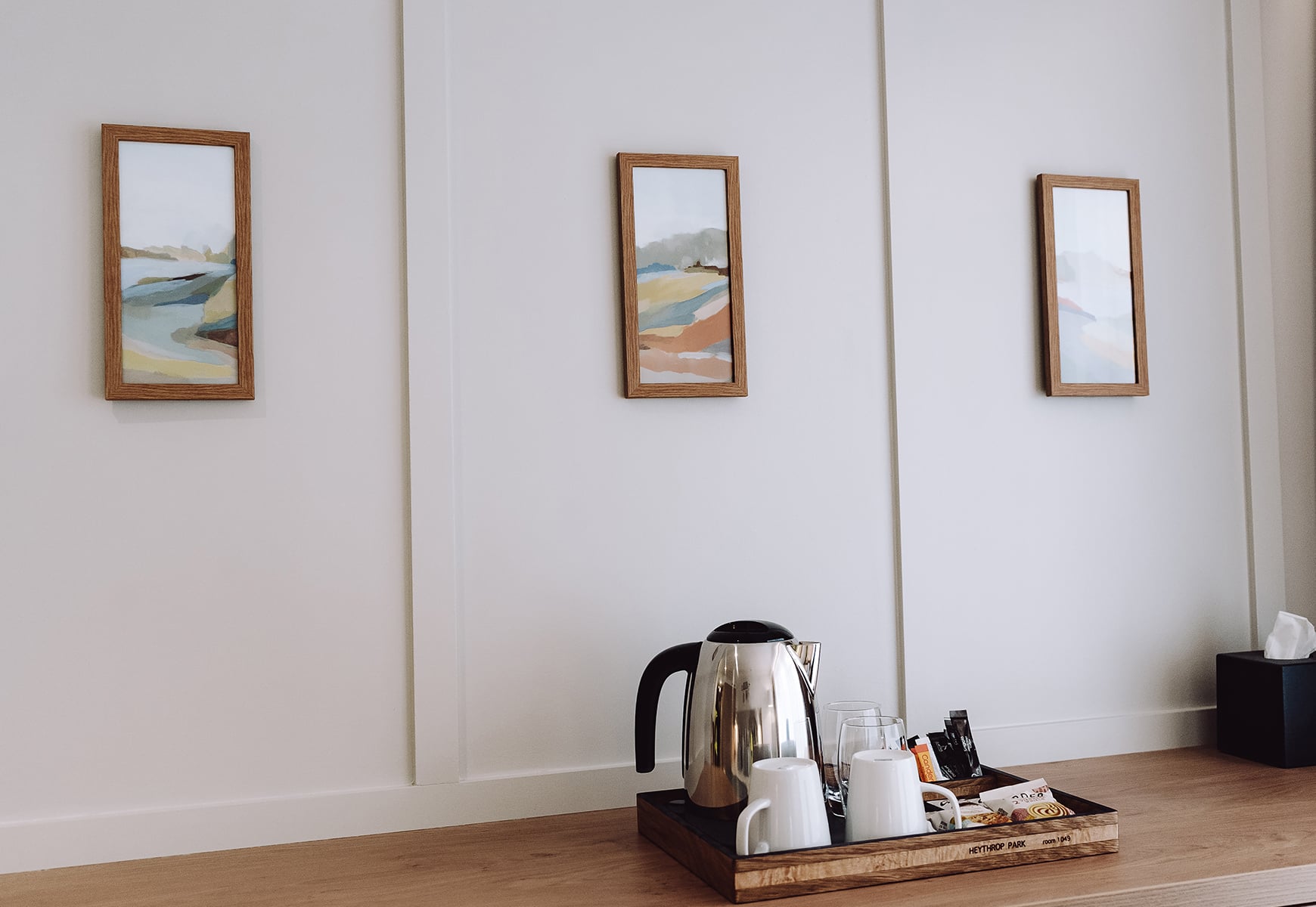 Wall art on walls and a tea tray