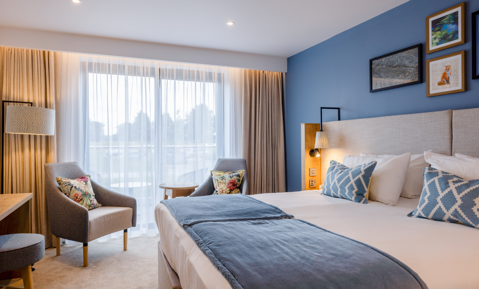 Bedroom with blue wall and relaxing lighting