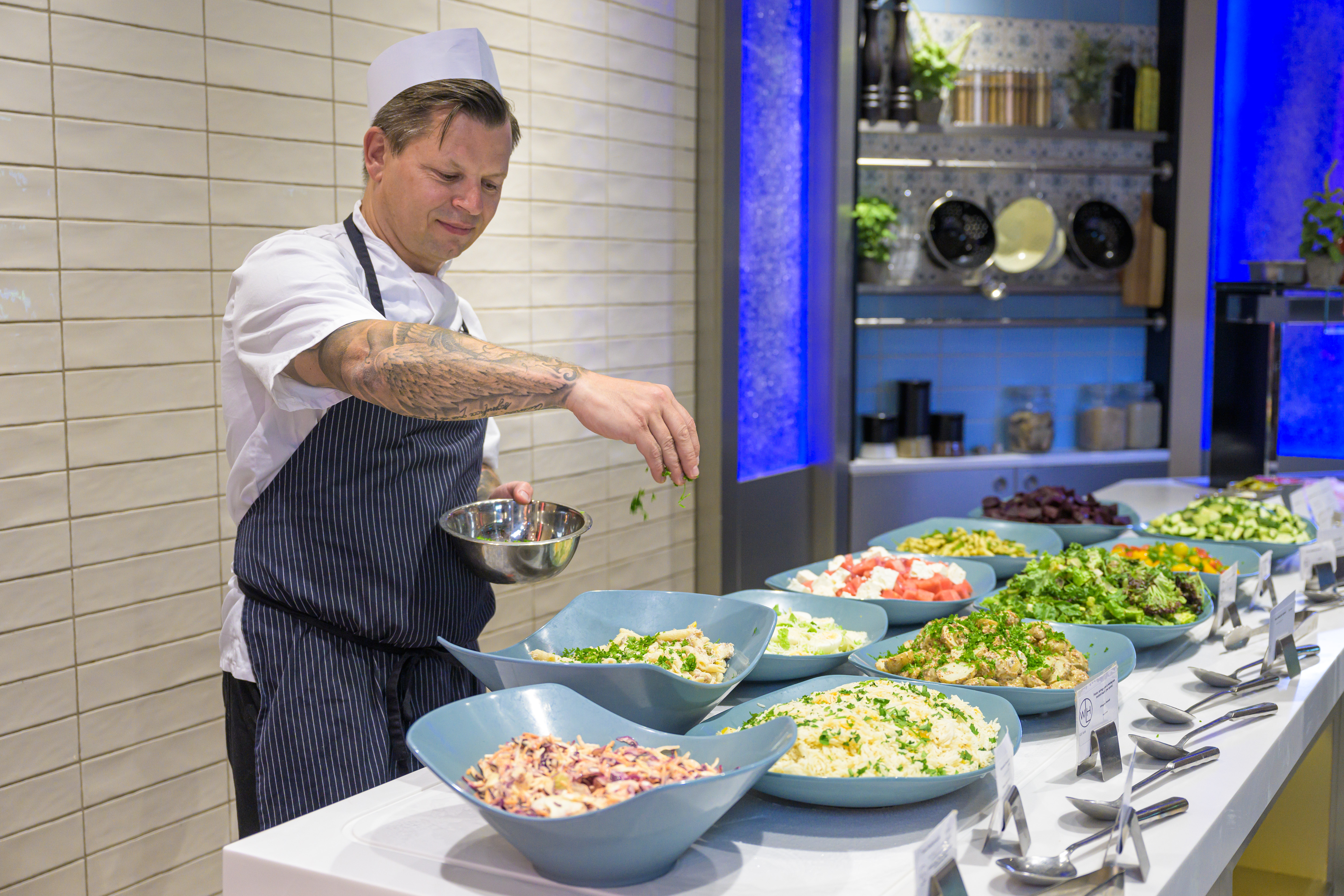 chef at salad bar