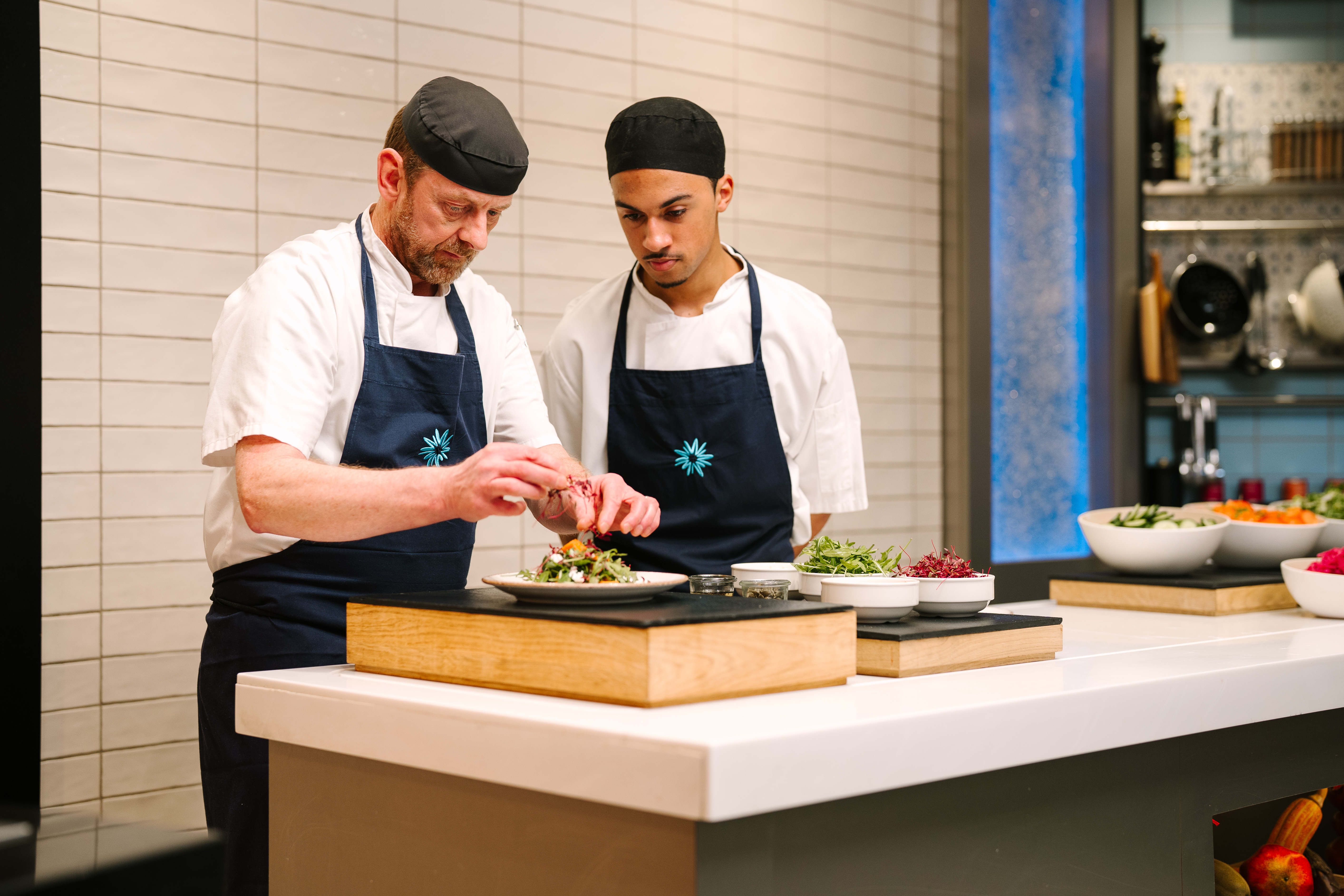 CHEFS AT MK MAKING FOOD