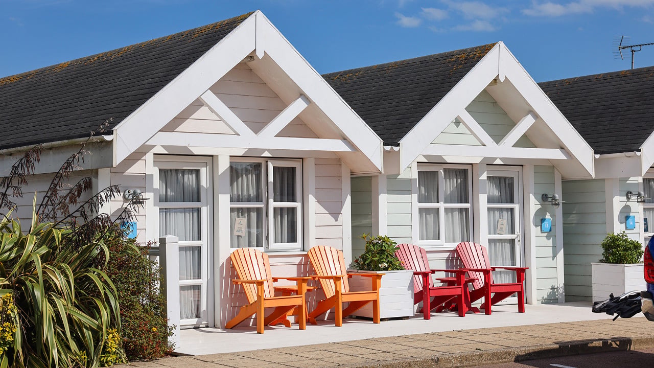 Clifftop Lodge with patio area and decking chairs