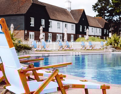 Poolside chairs and building