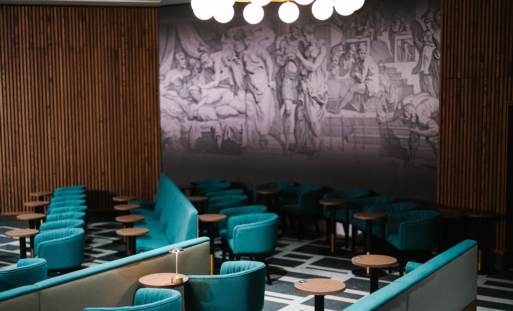 The show lounge at Thoresby Hall with comfortable blue chairs and a relaxed atmosphere